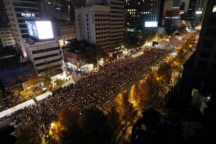 Candlelight vigils grieve Halloween disaster victims